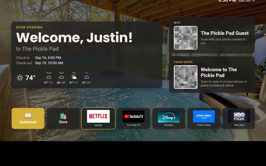 A Google TV welcome screen: Welcome, Justin with the dates, the WiFi and guidebook codes, and the app tiles