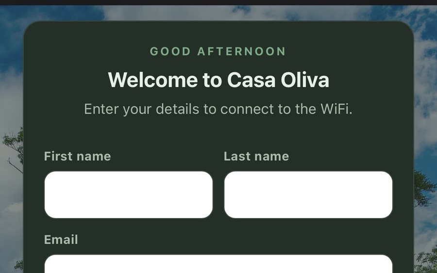 A guest's phone on the WiFi sign-in page: Welcome to Casa Oliva, name and email fields, and a Connect to WiFi button